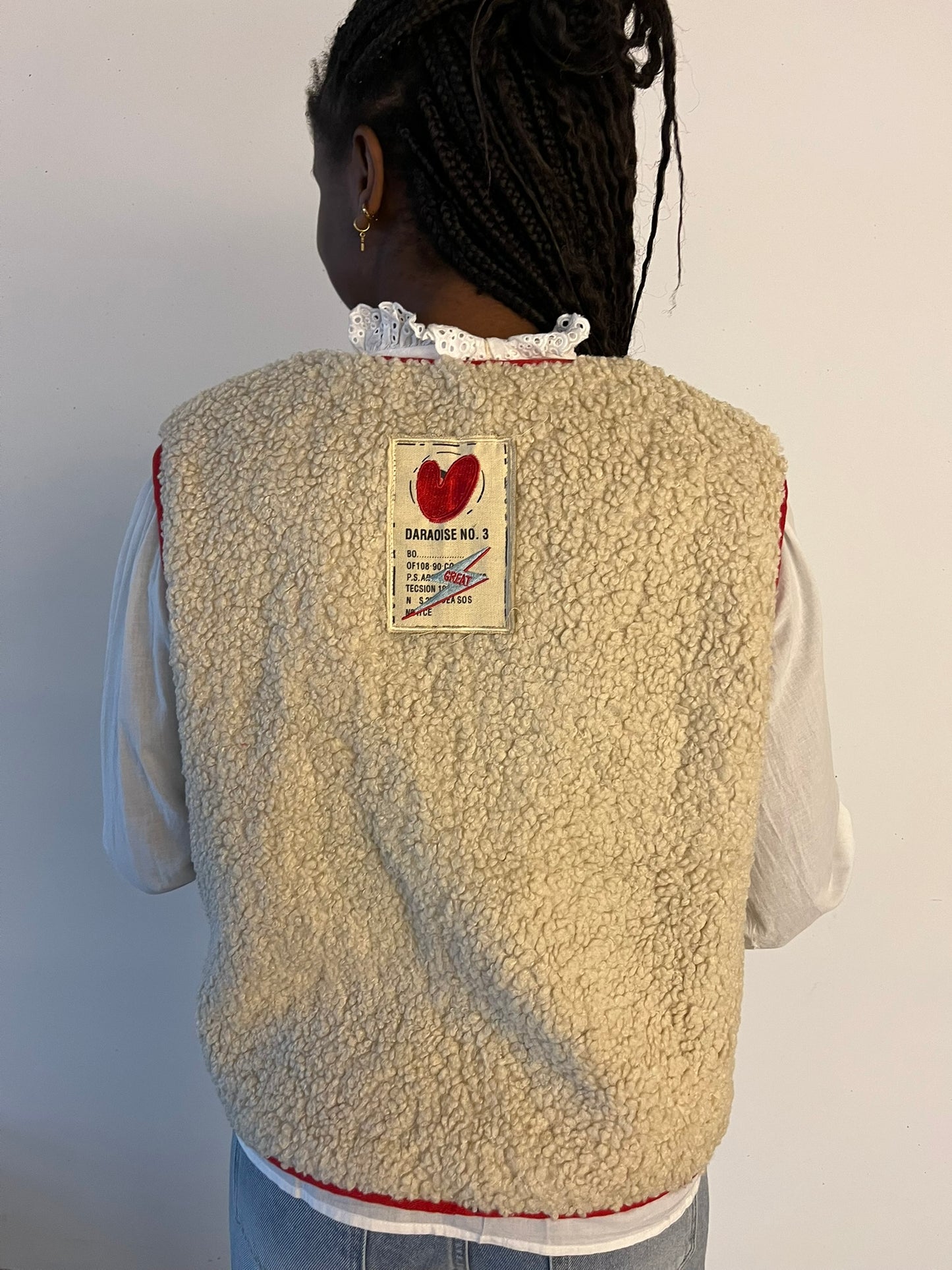 Bodywarmer teddy beige/rood omkeerbaar